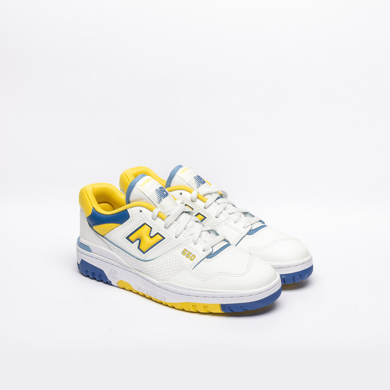 New Balance 550 low basketball sneaker in white leather with yellow accent