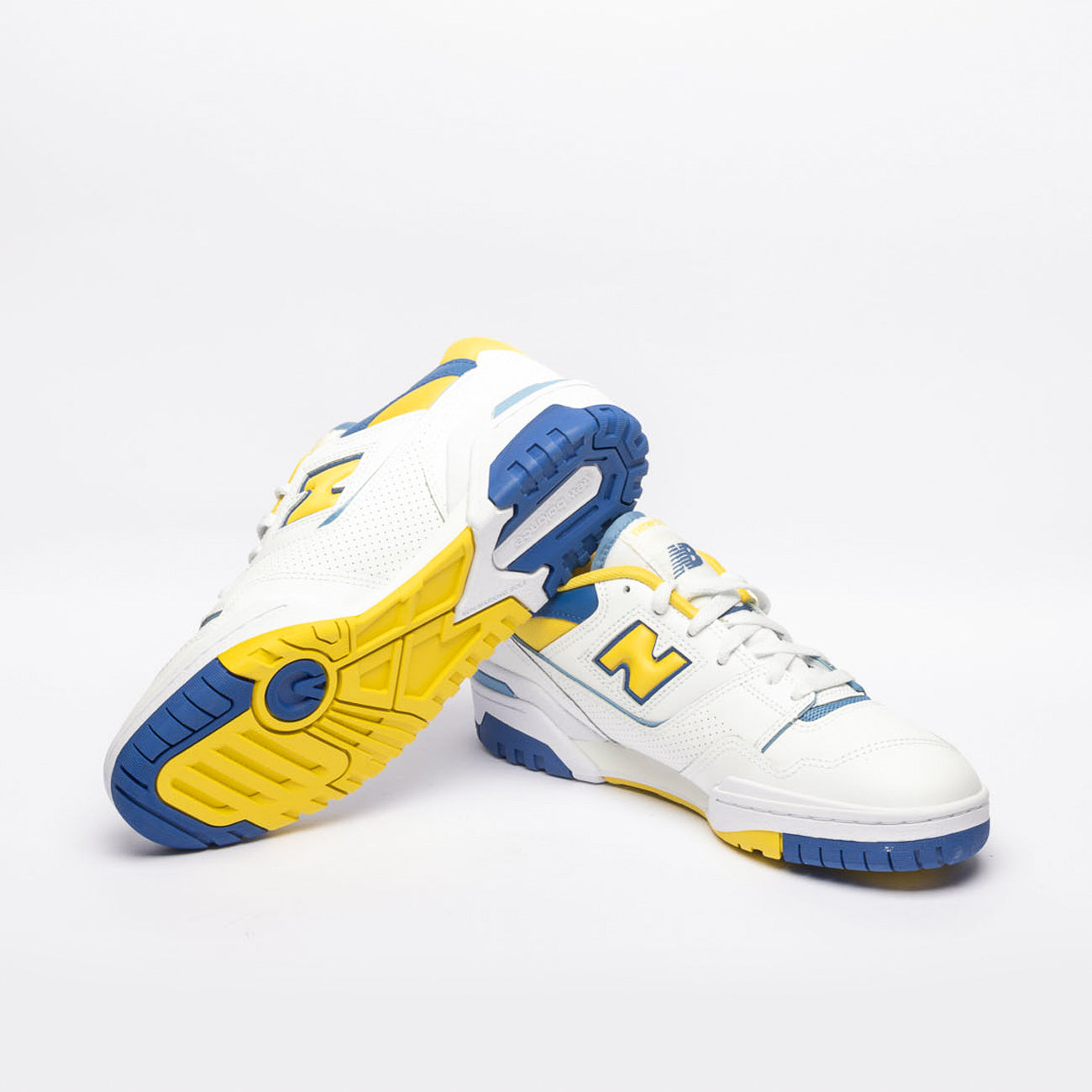 New Balance 550 low basketball sneaker in white leather with yellow accent